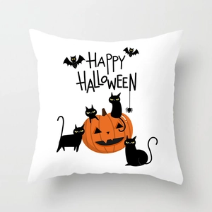 Macro detail of Halloween pillowcase with Happy Halloween text, black cats and pumpkins