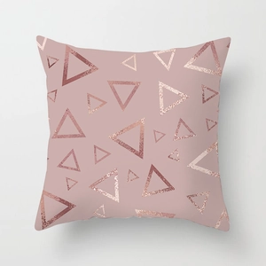 Detail of pink peach skin pillowcase with geometric rose gold triangle foil patterns
