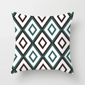 Close-up of geometric diamond pattern on green peach skin fabric cushion cover