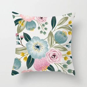 Detailed view of floral pattern on square cushion cover with pink and blue hand-painted flowers