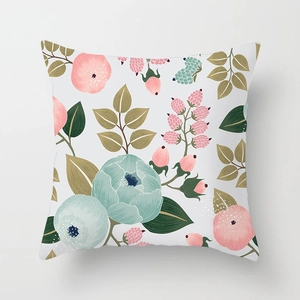 Detailed macro view of pastoral floral pillow cover with pink roses and green leaves