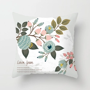 Detail of floral throw pillow cover featuring hand-painted blue flowers and pink berries