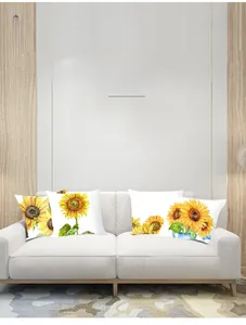 Detail of sunflower pattern cushion covers displayed on a modern white sofa