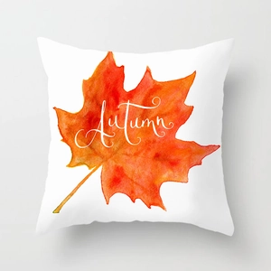 Autumn maple leaf pillow cover with orange watercolor leaf and white Autumn text