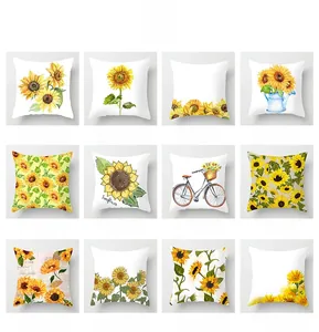 Grid of 12 distinct sunflower patterns on white cushion covers with floral motifs