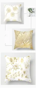 Détail de housses de coussin blanches aux motifs dorés de feuilles et de pissenlits