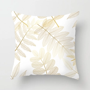Housse de coussin blanche moderne avec motif de feuilles dorées élégantes pour décor