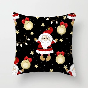 Detail of Christmas pillowcase featuring Santa Claus, golden bells, and festive string lights