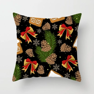 Detailed view of Christmas pillowcase with gingerbread house and pinecone illustrations