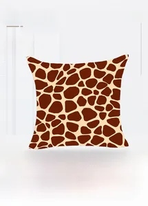 Detailed view of the square giraffe print pillowcase with thick fabric and rich brown texture