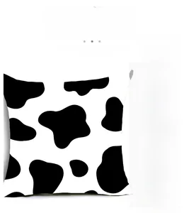 Detail of peach skin polyester pillowcase showing soft cow print pattern and texture