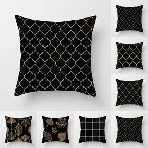 Modern black and gold geometric throw pillow covers with elegant leaf patterns for sofa decor