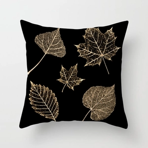 Modern black throw pillow cover with golden leaf vein patterns for elegant home sofa decor