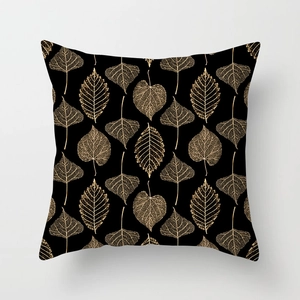 Detailed view of square black pillow cover with golden leaf vein metallic printing