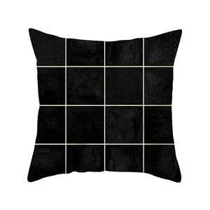 Modern black geometric throw pillow cover with golden grid pattern on a white background