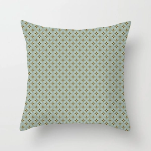Macro shot of geometric star pattern fabric and fine stitching on square cushion cover