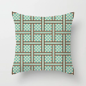 Detailed view of square geometric woven cushion cover with teal and brown checkered texture