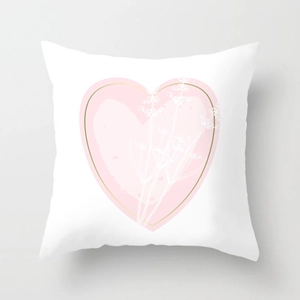 Detail of soft white square pillowcase with pink heart and gold outline floral pattern