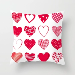 Detailed view of white square cushion cover with 16 diverse red heart grid patterns