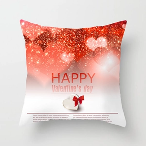 Detailed view of red heart pattern and festive greeting on Valentine's square pillowcase
