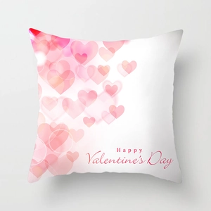Detail view of white square pillowcase with pink hearts and Happy Valentine's Day text