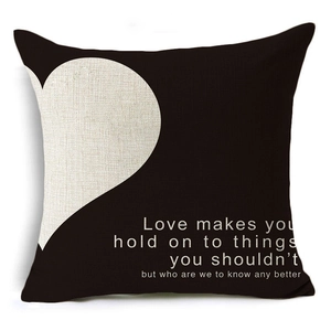 Detail of linen pillow cover featuring heart pattern and romantic quotes for Valentine