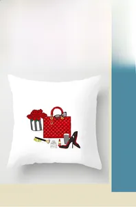 Close-up of heart-themed red handbag and rose illustration on white pillow cover
