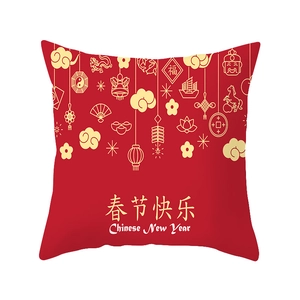 Red Chinese New Year pillow cover with gold dragon motifs and festive patterns