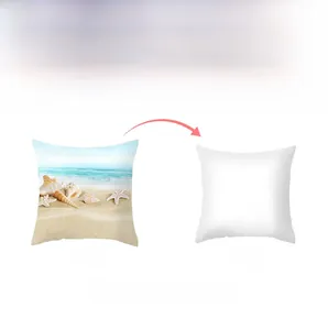 Detail of beach shell pattern cushion cover showing sea wave print and white reverse side