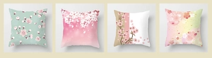 Detailed view of four square peach skin pillow covers featuring floral cherry blossom patterns