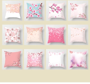 Detailed grid view of twelve peach skin pillow covers with pink cherry blossom floral prints