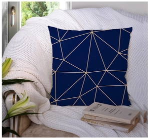 Detailed view of square blue and gold marble geometric cushion cover on a cozy chair