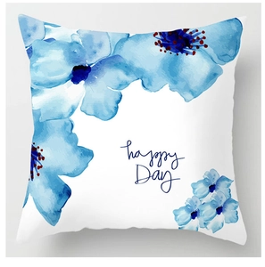 Detailed close-up of blue watercolor floral cushion cover featuring happy Day text print
