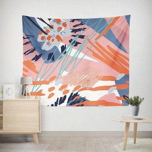 Abstract botanical tapestry with pink and orange patterns hanging on a white wall