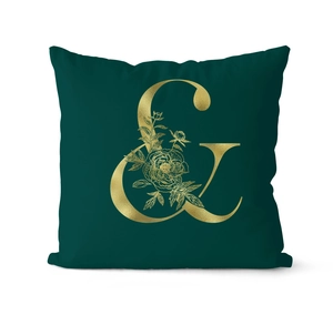Close-up of luxury dark green velvet pillowcase with gold foil ampersand and floral pattern
