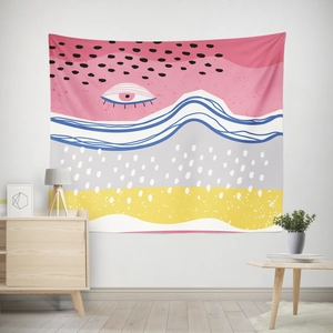 Detail view of abstract eye pattern tapestry styled in a modern living room interior