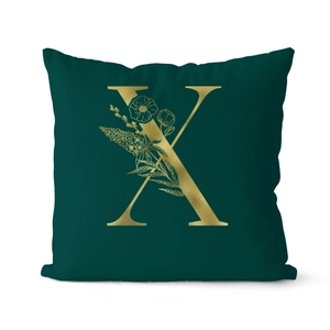 Luxurious dark green velvet cushion cover with golden letter X and floral patterns