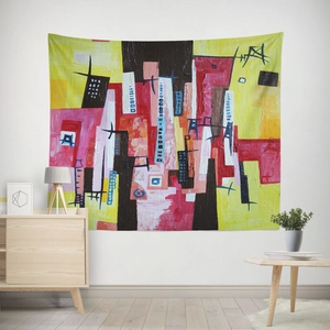 Modern abstract wall tapestry with yellow and red geometric shapes in a cozy living room