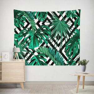 Close-up of tropical green leaves pattern on geometric tapestry for home wall decor