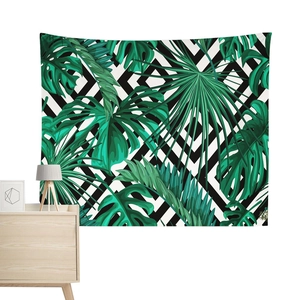 Nordic tropical leaves tapestry with black and white diamond geometric pattern on a wall