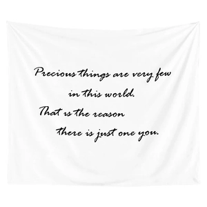 Detail of white polyester wall tapestry featuring black handwritten artistic quotes