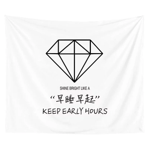Detail view of white tapestry with minimalist diamond line art and motivational text