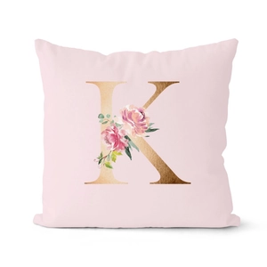 Pink rose gold letter K decorative pillow case with elegant floral pattern on white background