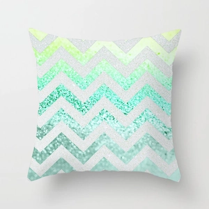 Detail of mint green chevron decorative pillow cover with subtle glitter texture