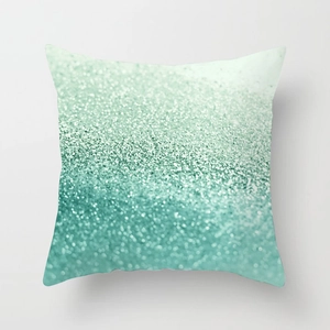 Detailed view of mint green gradient glitter texture on a square pillowcase