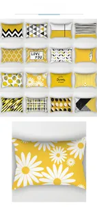 Dettaglio di varie federe con motivi geometrici gialli e stampe moderne decorative