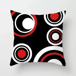 Macro shot of red abstract geometric concentric circles on modern decorative pillow case