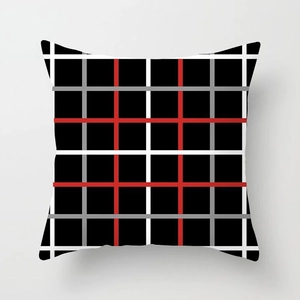 Close-up of modern square pillow cover with red, white and grey plaid woven pattern