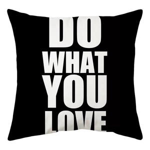 Detail of minimalist black pillow case featuring white DO WHAT YOU LOVE typography