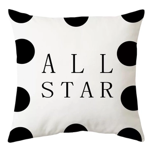 Detail view of peach skin fabric pillowcase with All Star text and black polka dot pattern